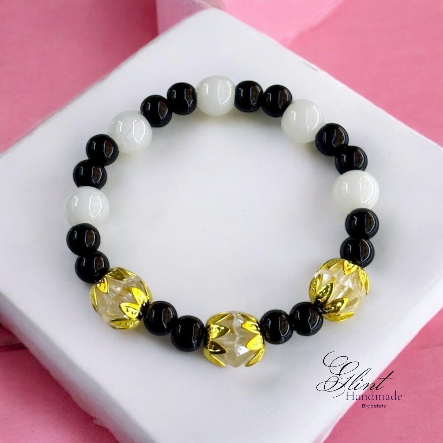 Black and White Bead Bracelet with Gold Floral Accents